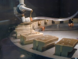 A high intensity discharge circuit being potted under vacuum.